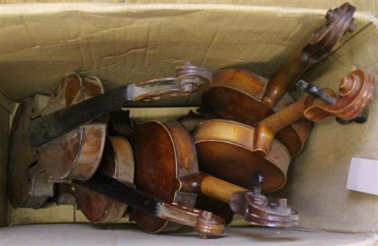 7 cased violins and 5 other uncased incomplete violins